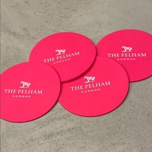 NWOT THE PELHAM LONDON BOUTIQUE HOTEL PINK RUBBER COASTERS SET OF 4